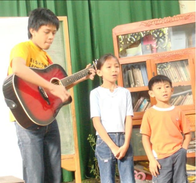 Children in Solano, in the Philippines, enjoy music during last year's Ayyam-i-Ha festivities at the local Baha'i center.