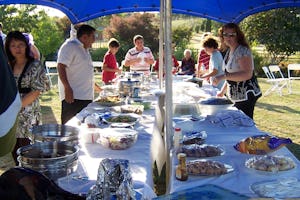 Friends who gathered in Eureka in the Waikato region of New Zealand set the banquet table for their Naw Ruz celebration.