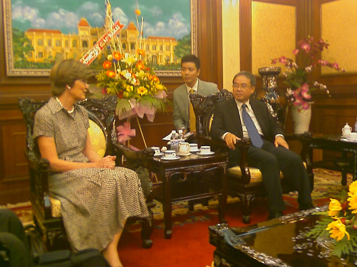 An emissary of the Universal House of Justice, Mrs. Joan Lincoln, pays a courtesy call to the vice chairman of the People's Committee of Ho Chi Minh City at the seat of government there.