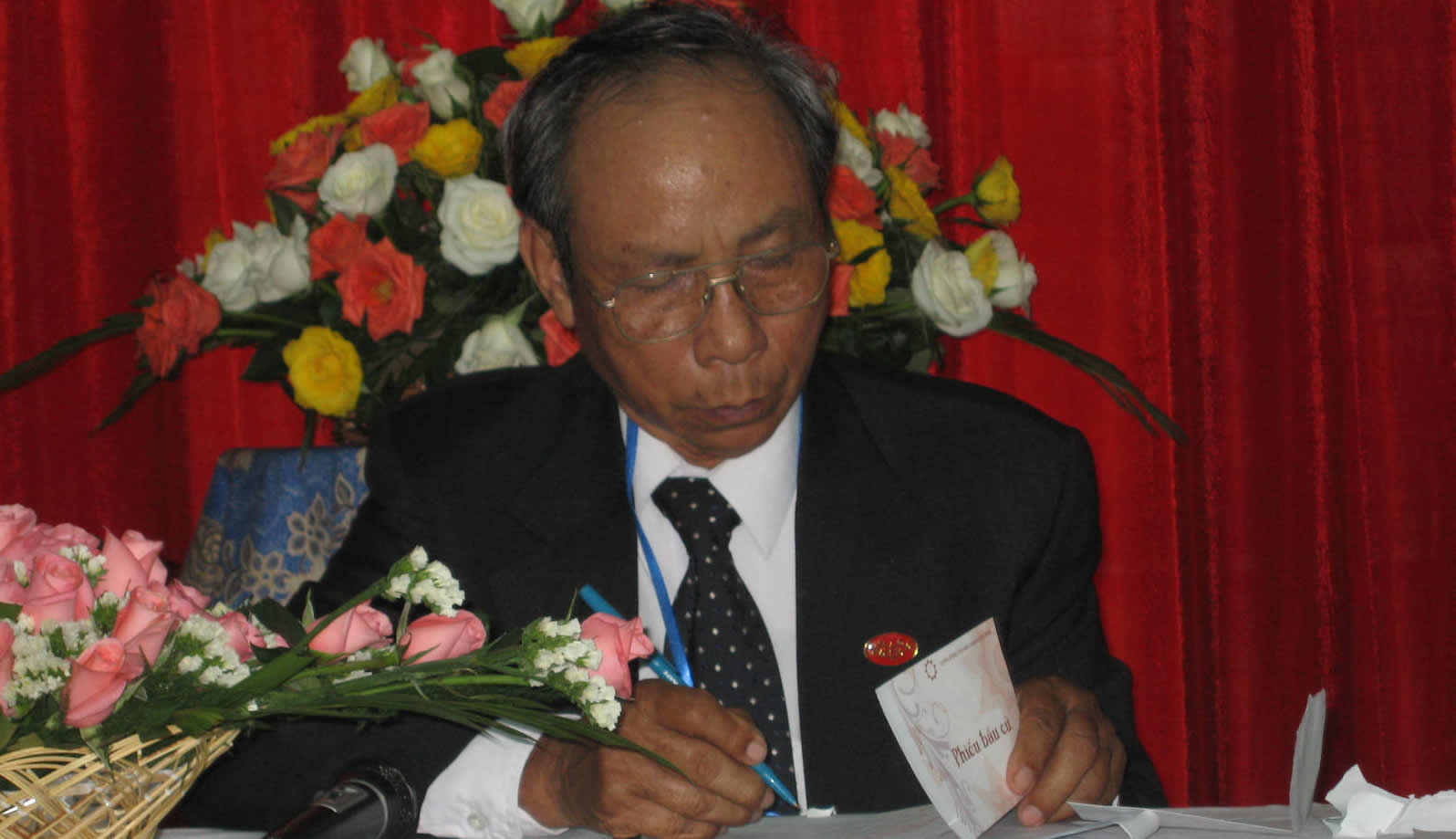 The chairman of the national convention, Nguyen Thuc, attends to his duties during the first day of proceedings.