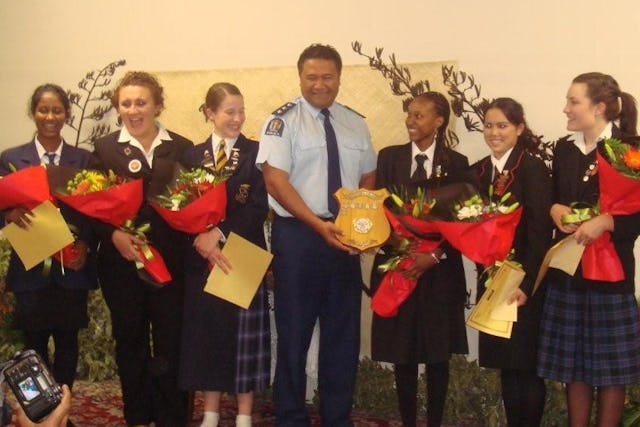 In Auckland, New Zealand, a representative of the New Zealand Police presents the winner's shield for the 2008 Race Unity Speech Award to Charon Maseka of Wellington. With them are the other finalists for the award.