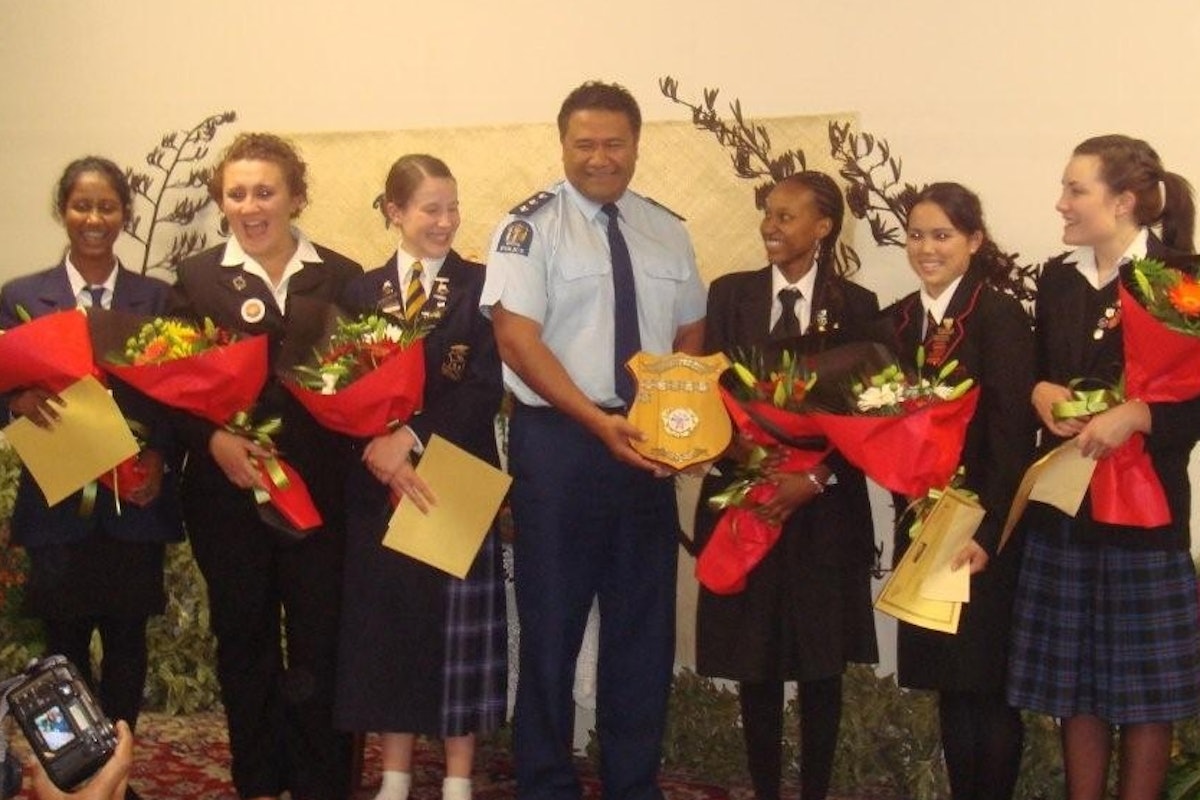 In Auckland, New Zealand, a representative of the New Zealand Police presents the winner's shield for the 2008 Race Unity Speech Award to Charon Maseka of Wellington. With them are the other finalists for the award.