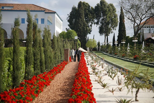 At Bahji near Acre are the home, left, where Baha'u'llah lived His final years and the Shrine, at right, where His earthly remains are buried. Those attending the International Convention went there for personal prayer upon arrival in the Holy Land.