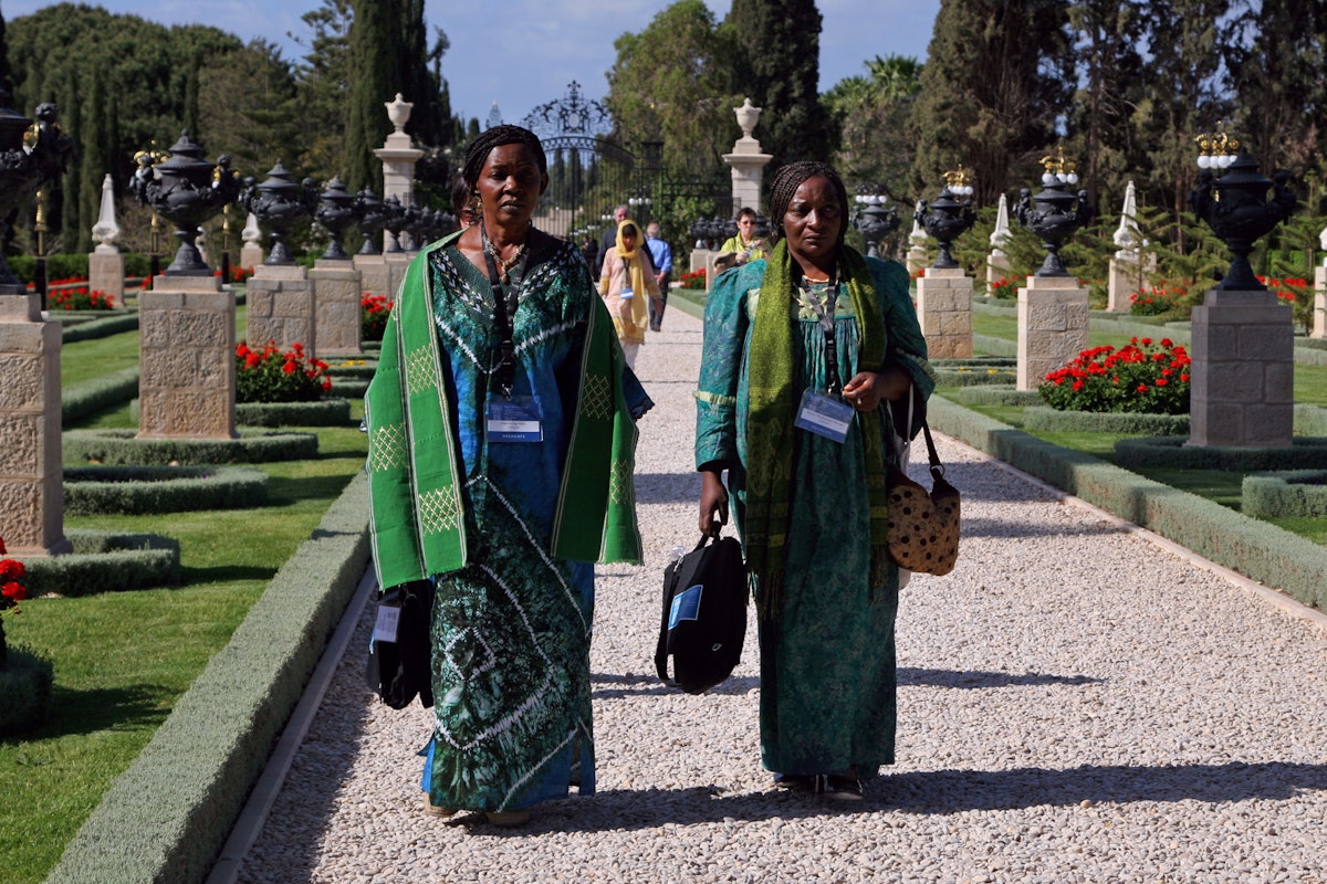 Delegates from Cameroon walk toward the Shrine of Baha'u'llah at Bahji, near Acre.