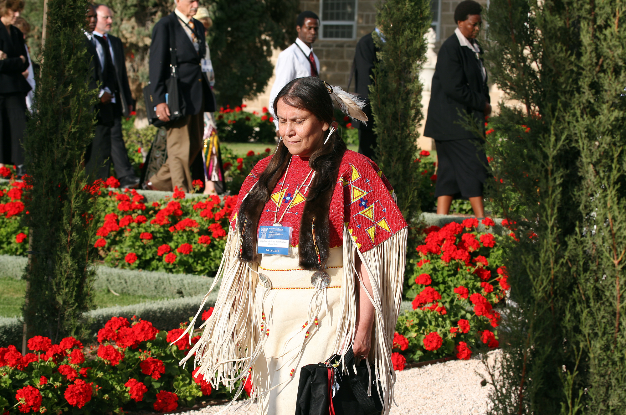 One of the delegates from the United States is a Native American who donned her people's traditional dress for the Holy Day celebration.