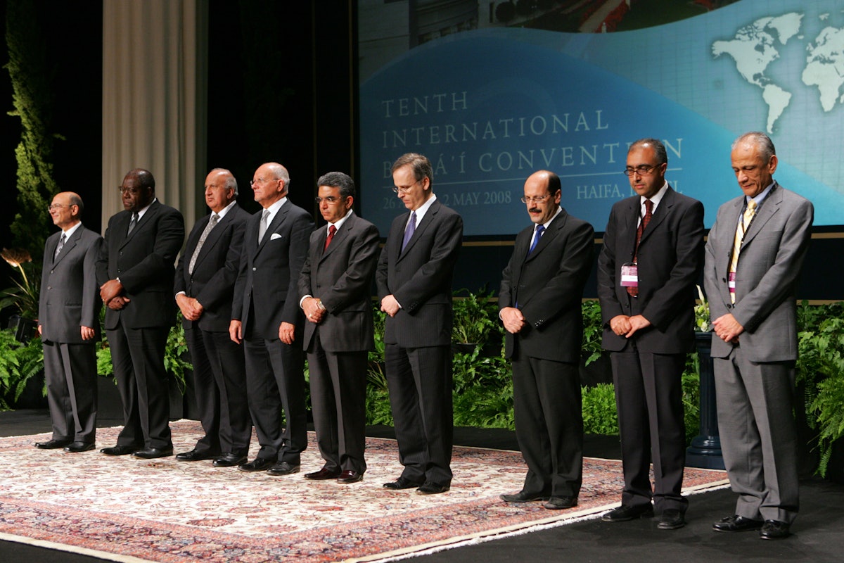 The members of the Universal House of Justice are, from left to right, Farzam Arbab, Kiser Barnes, Peter Khan, Hooper Dunbar, Firaydoun Javaheri, Paul Lample, Payman Mohajer, Shahriar Razavi, and Gustavo Correa. They were elected by delegates to the 10th International Baha’i Convention in Haifa. Election results were announced on 30 April.