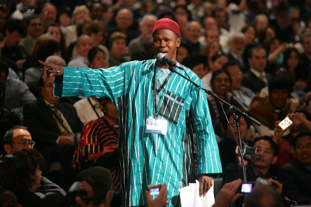 A delegate from Benin shared experiences from his country, then – noting that the Africans liked singing at their gatherings – led the convention participants in a catchy Baha’i song.