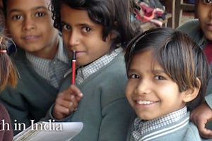 Children at one of the community schools in Uttar Pradesh smile for a visitor. The Foundation for the Advancement of Science in Lucknow offers know-how to help teachers and administrators with curriculum and planning.