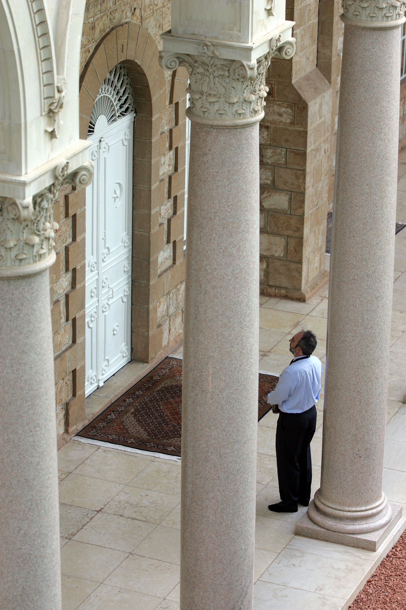 A visitor prays at the Shrine of the Bab in Haifa. An interior chamber adjacent to the tomb, inside, also is open to Baha’is and the public for prayer and meditation.