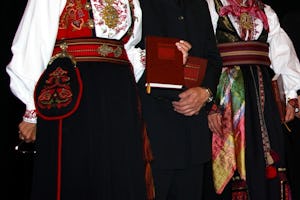 Britt Strandli-Thoresen, Kjell Austvoll, and Kitt Sanvik read excerpts from the Kitab-i-Aqdas during the ceremony at Beitostolen for the presentation of the Norwegian edition.