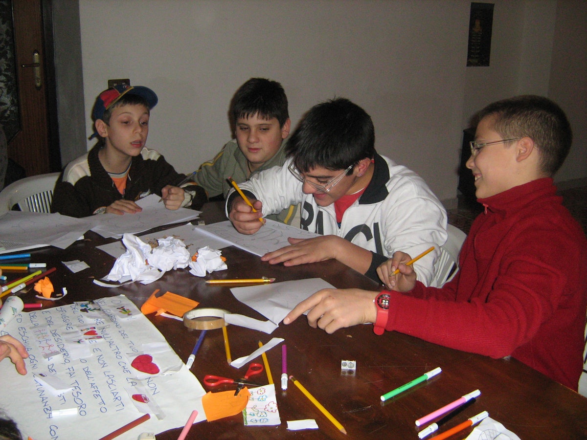 Through discussion, service projects, the arts, and games, the classes in Portici help young people learn respect for themselves and others and how to serve the community.