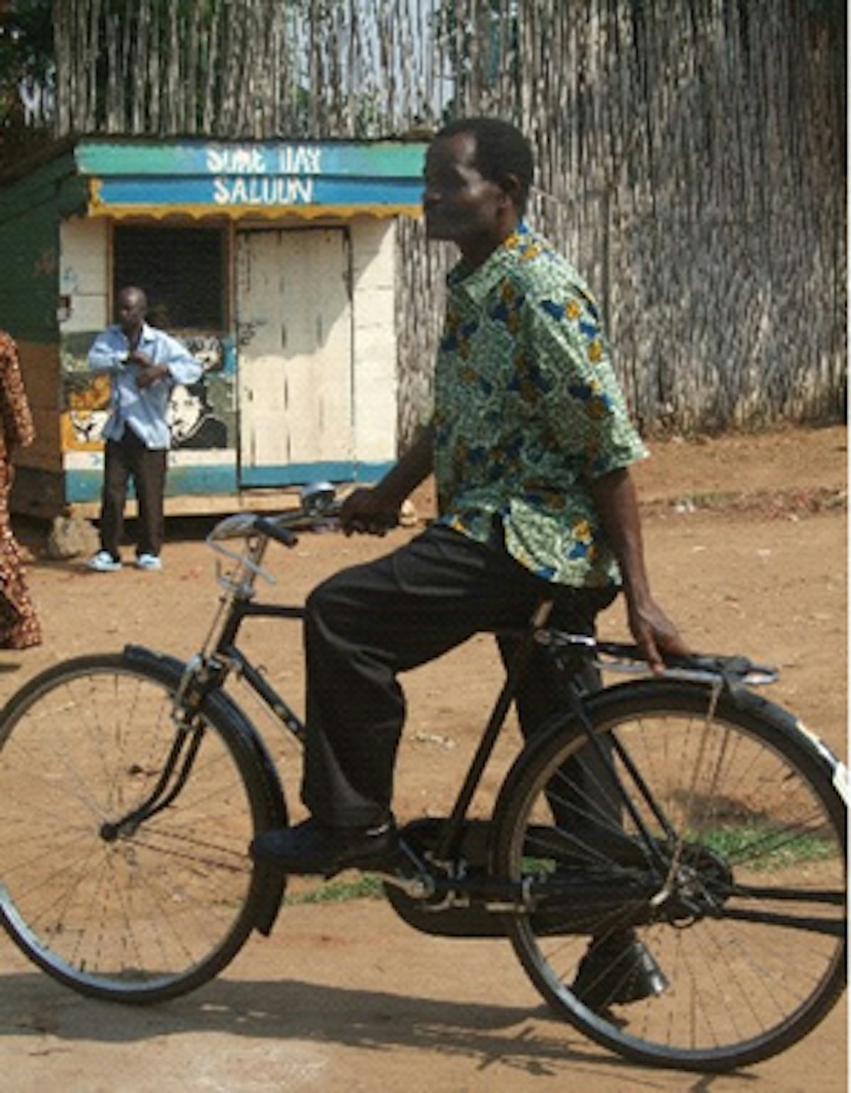 Hizzaya Hissani, UPLIFT program director, uses a bicycle to travel from village to village to monitor the program and consult with participants.