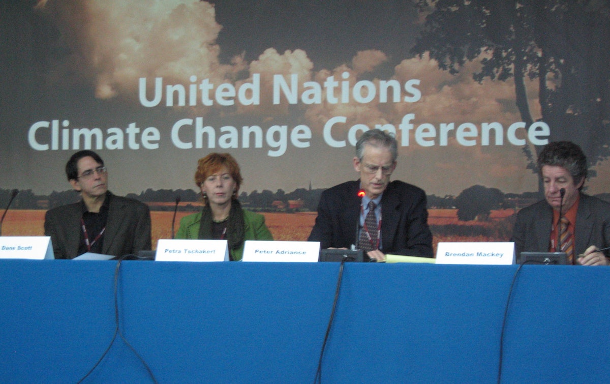 Baha’i representative Peter Adriance, second from right, speaks during a panel discussion on "Moral and ethical issues that must be faced in implementing the Bali roadmap.” Others, from left, are Dane Scott of the University of Montana at Missoula, Petra Tschakert of Penn State University, and Brendan Mackey of the Australian National University.