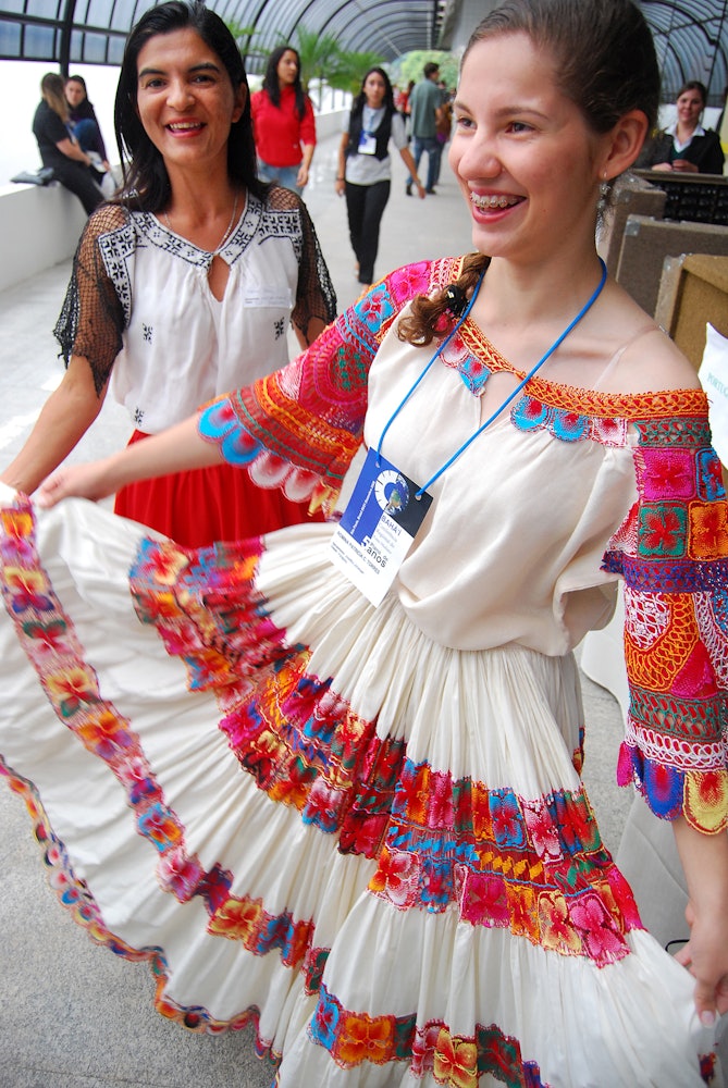 Romina P.C. Torres of Paraguay shows off her dress at the conference venue in Sao Paulo.