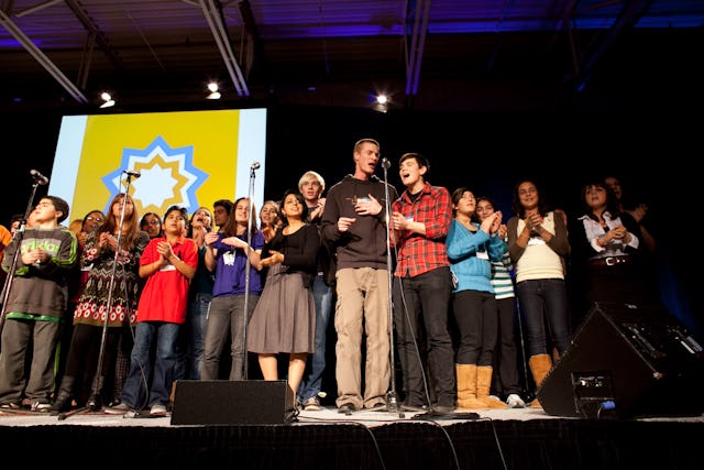 Young people join for a presentation at the conference in Toronto, which with 4,000 people was one of the largest gatherings in the current series.