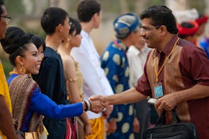 Greeters in traditional costumes from the participating countries of Cambodia, Laos, Thailand, and Vietnam welcome people arriving to the Baha'i conference in Battambang.