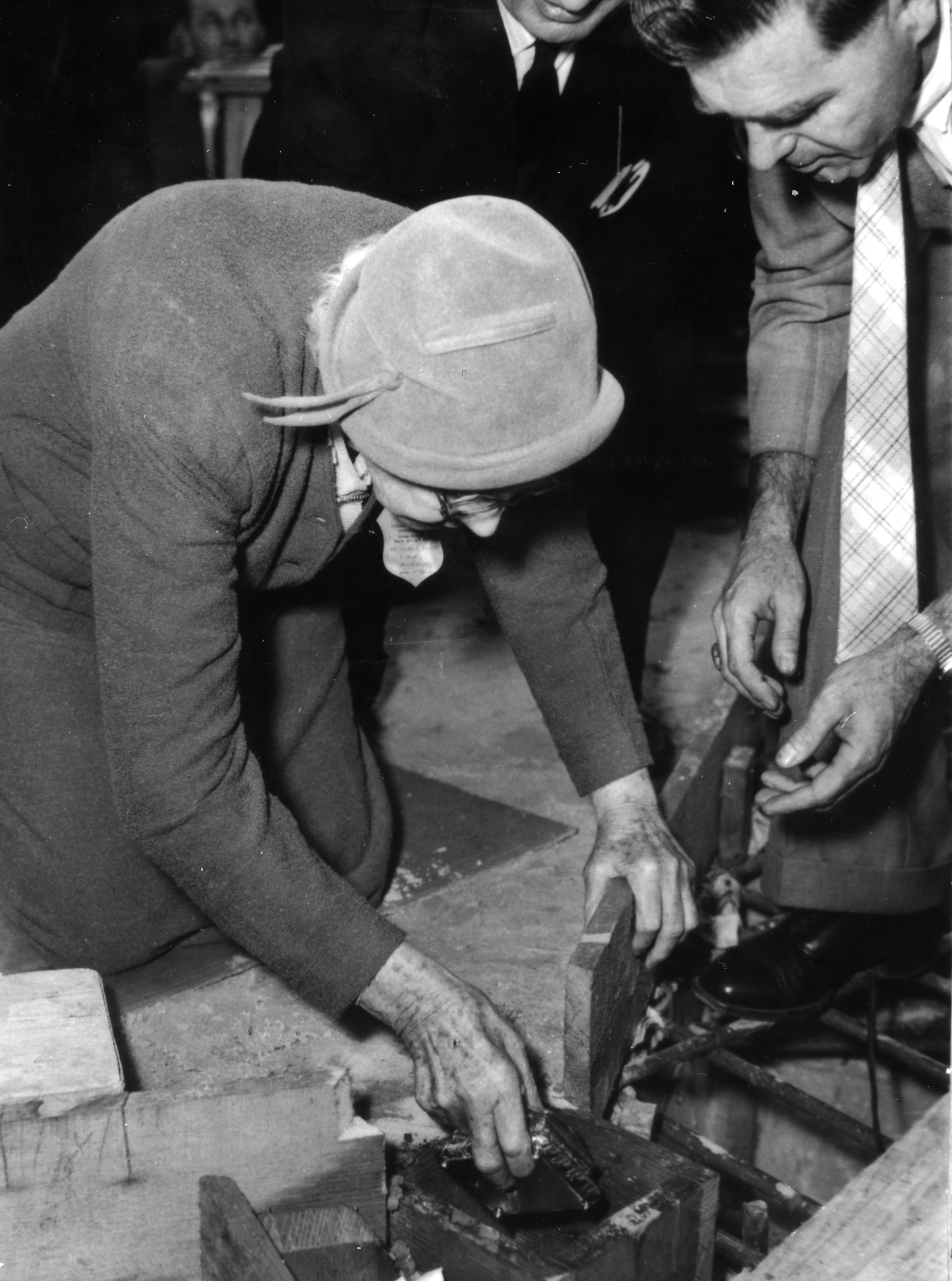 Mrs. Clara Dunn, Baha'i Hand of the Cause, participates in the foundation-laying ceremony for the Baha’i House of Worship in Sydney, Australia. The ceremony was held during the intercontinental conference in Sydney in March 1958. (Baha’i World Centre photograph)