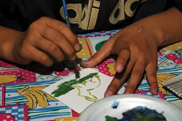 The young people are offered space and materials for their work, but Beth McKenty says she "never really instructed these children." (Photo copyright 2004 Nunatsiaq News. Used with permission.)