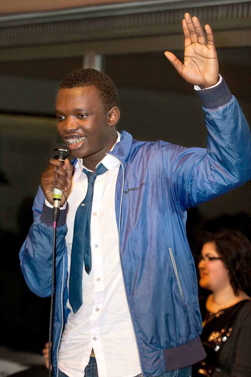 A member of the People’s Theater gestures as the group performs for Human Rights Day at the National Baha’i Center in Germany. The troupe often gives presentations for young people, demonstrating ways to cope with conflict in schools.