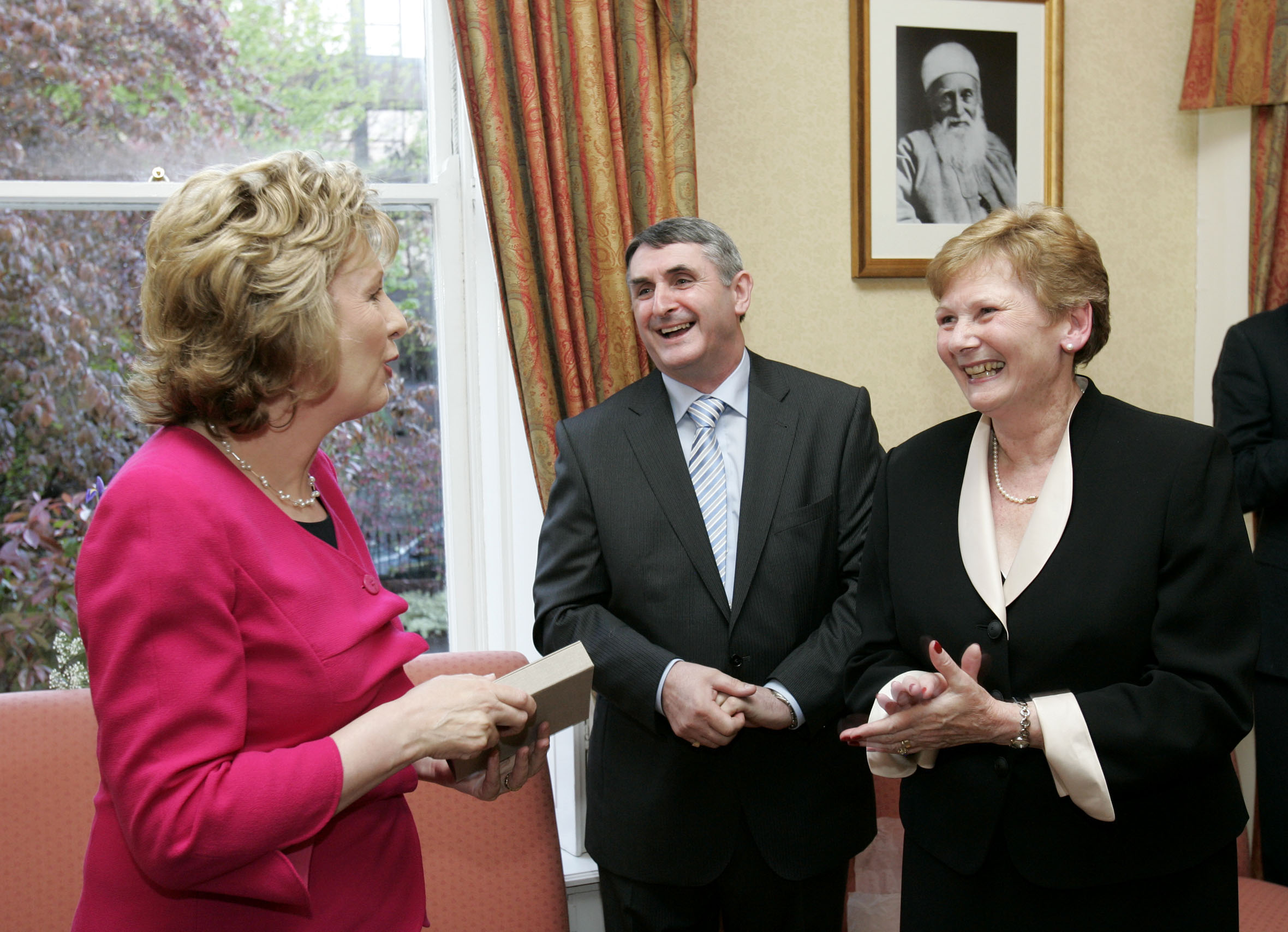 The President of the Republic of Ireland, Mary McAleese, left, talks with two members of the National Spiritual Assembly of the Baha'is of Ireland - Mr. Brendan McNamara and Mrs. Alison Wortley.