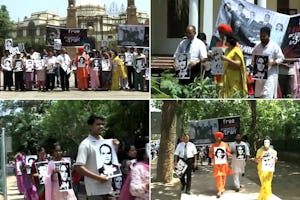 تصوير هفت مدير زندانی بهائی در راهپيمائی 'اتحاد برای ايران' در دهلی نو. اين تصوير از ويدئوی اين مراسم برداشته شده است.