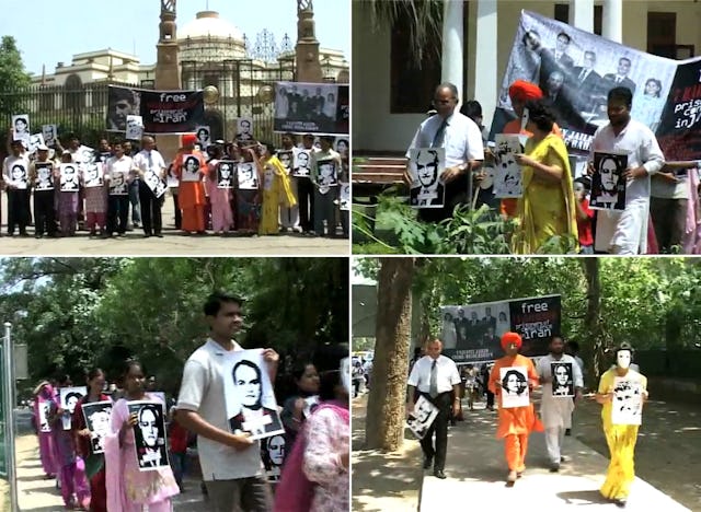 Images of the seven imprisoned Baha'i leaders featured prominently in the United4Iran march through the streets of New Delhi. Photographs taken from video footage.