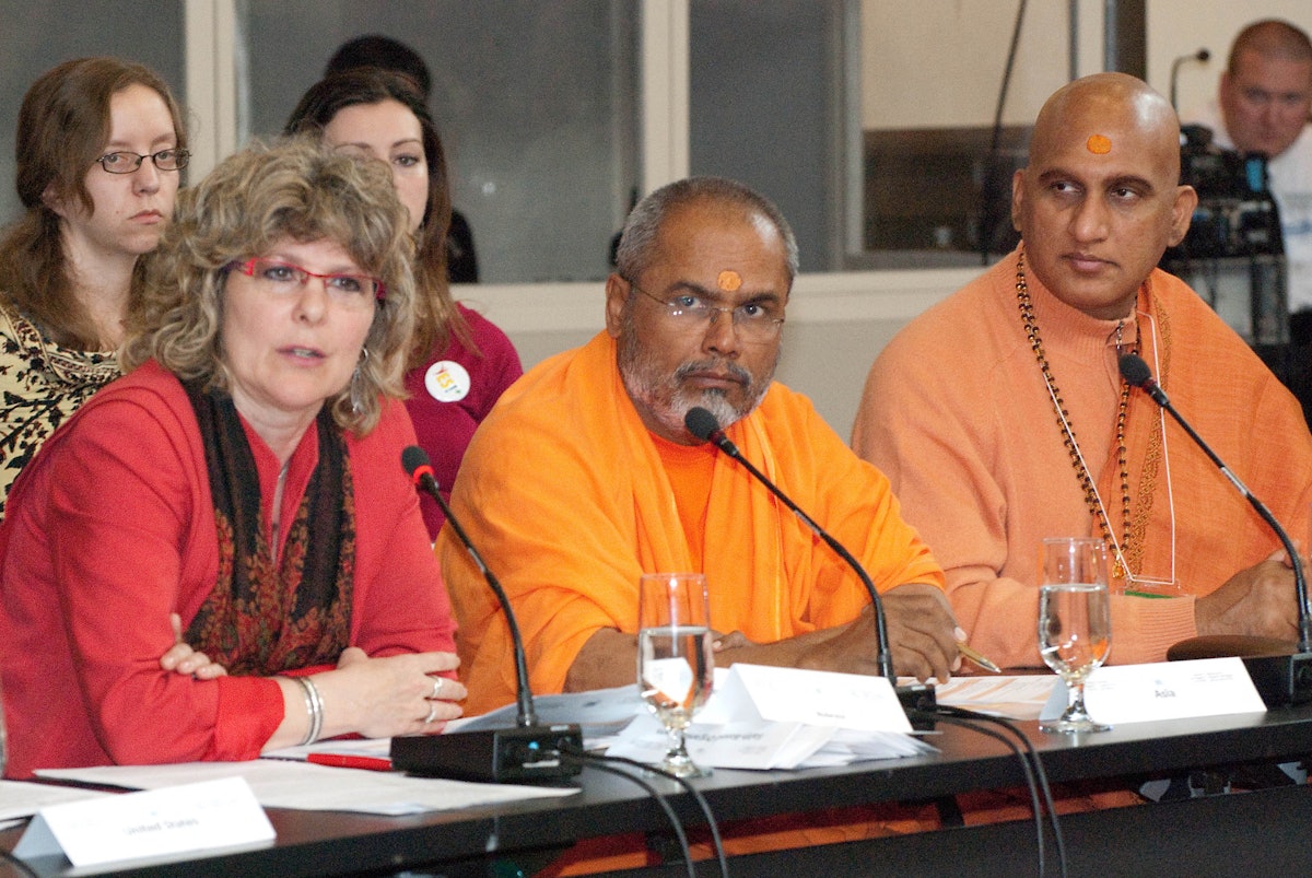 Delegates to the 2010 World Religions Summit attended from more than 20 countries. Seated left to right are: the Rev. Dr. Karen A. Hamilton, general secretary of the Canadian Council of Churches; H.H. Swami Paramatmananda Saraswati and Swami Avdheshanand Giri, of the Hindu Dharma Acharya Sabha. Photograph by Louis Brunet.