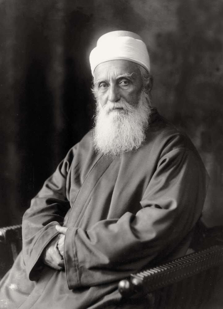 'Abdu'l-Baha, formally photographed at the famous Taponnier studio in Paris. He told one meeting in the French capital, "In this room today are members of many races...brothers and sisters meeting in friendship and harmony! Let this gathering be a foreshadowing of what will, in very truth, take place in this world, when every child of God realizes that they are leaves of one tree, flowers of one garden, drops in one ocean, and sons and daughters of one Father, whose name is love!"