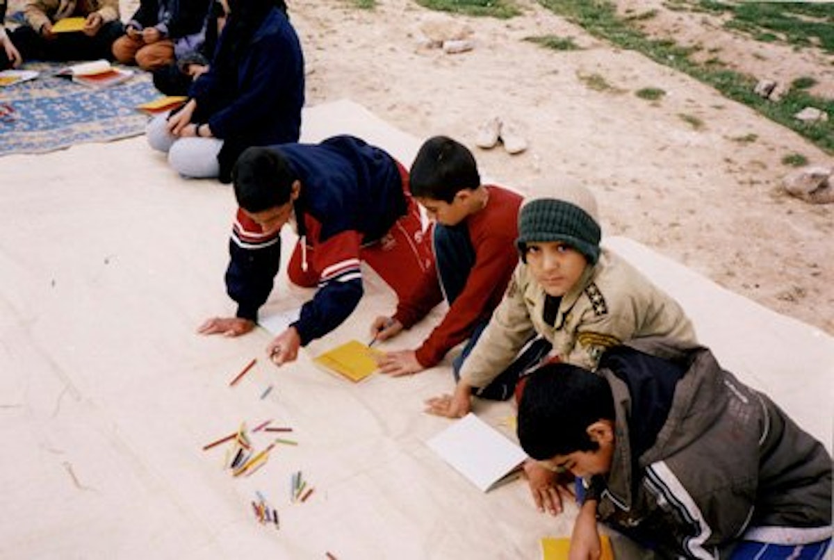 Children working in their class in Sahlabad, outside Shiraz, Iran. Such classes were shut down by the government in 2006.