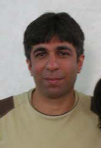 Sasan Taqva – pictured in May 2009, 18 months into his four-year imprisonment in a Ministry of Intelligence detention center in Shiraz. Born in 1974, Mr. Taqva was trained as an optometrist and had his own business. However, to suppress dealings with Baha'is, the Ministry of Trade ordered other shopkeepers not to purchase anything from Baha'is. Before his arrest, he was a member of the national Baha'i Youth Committee.
