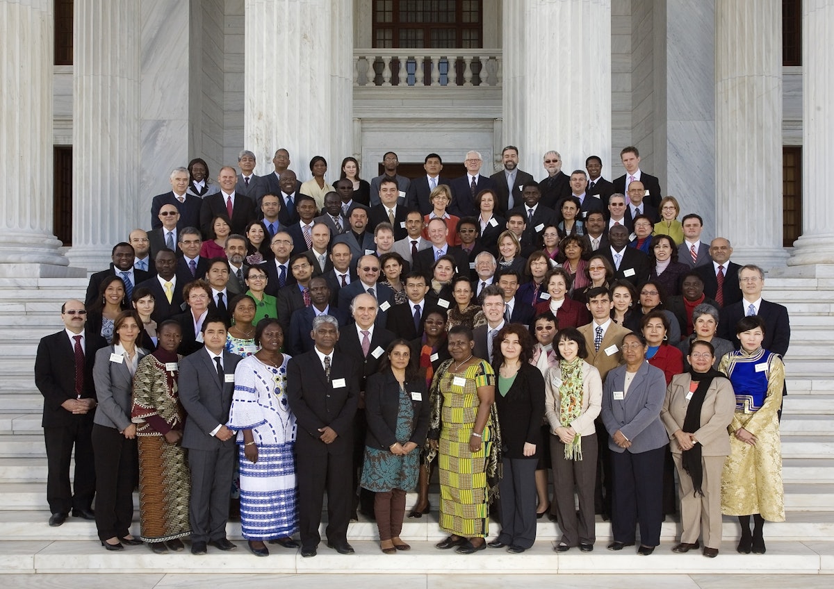 Members of the Continental Boards of Counsellors - gathered on the steps of the Seat of the Universal House of Justice - with members of the Universal House of Justice and the International Teaching Centre. The five Continental Boards of Counsellors have the responsibility of educating, encouraging, and stimulating the development of Baha'i communities throughout the world. The photograph was taken on the first day of their conference, 28 December 2010.