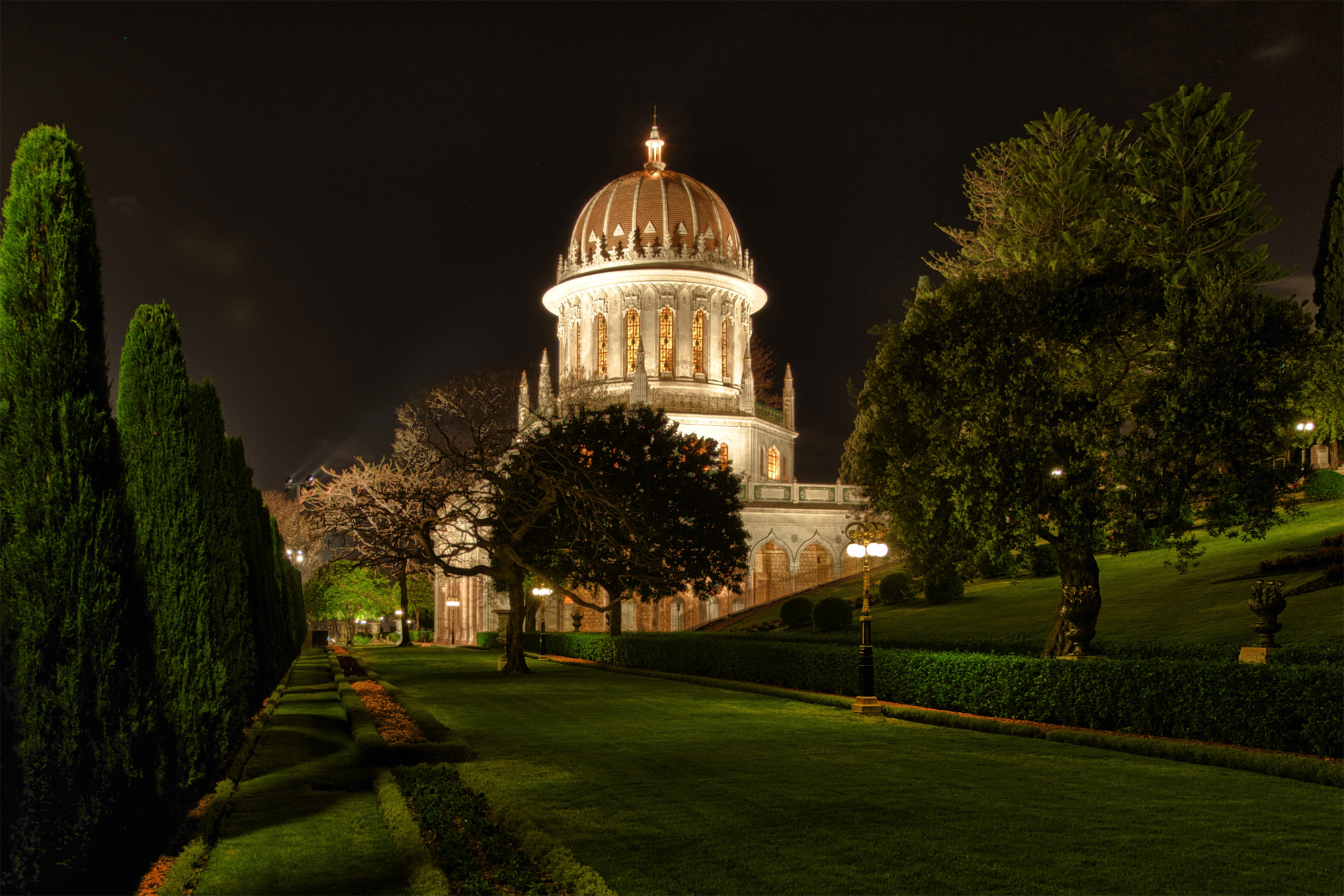 A night view of the Shrine of the Bab on Mount Carmel, Haifa, from its western gardens, 12 April 2011. Photo credit: Baha’i World Centre photo. All rights reserved.