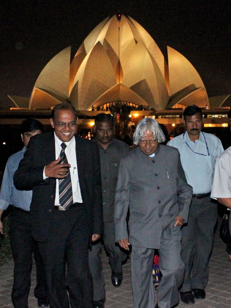 Former President of India Dr. A.P.J. Kalam, pictured front right, returning from a prayer service marking the inauguration of the 25th anniversary year of the Baha'i House of Worship in New Delhi.