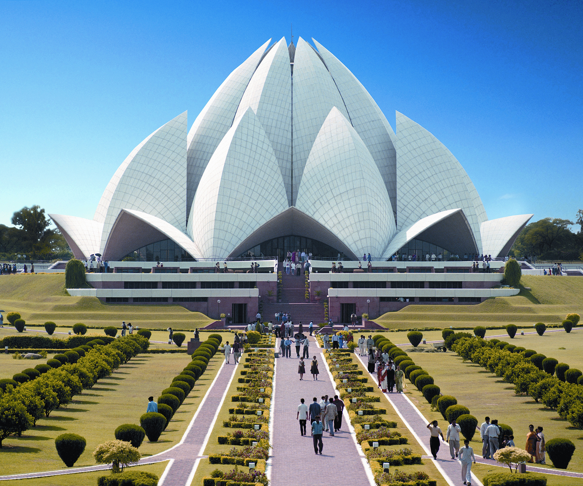Completed in 1986, the spectacular Baha'i House of Worship in New Delhi, India is one of the most visited buildings in the world, receiving an average of 4.3 million visitors per year. It has won numerous architectural awards. Inspired by the lotus flower, its design is composed of 27 free-standing marble clad "petals."