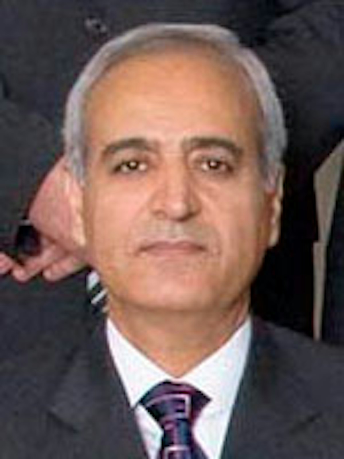 Behrouz Tavakkoli, one of Iran's seven imprisoned Baha'i leaders and Valiollah Toosky's brother-in-law, currently serving a 20-year jail sentence. Mr. Toosky had taught Mr. Tavakkoli carpentry skills after he was fired from his job as a government social worker for being a Baha'i.