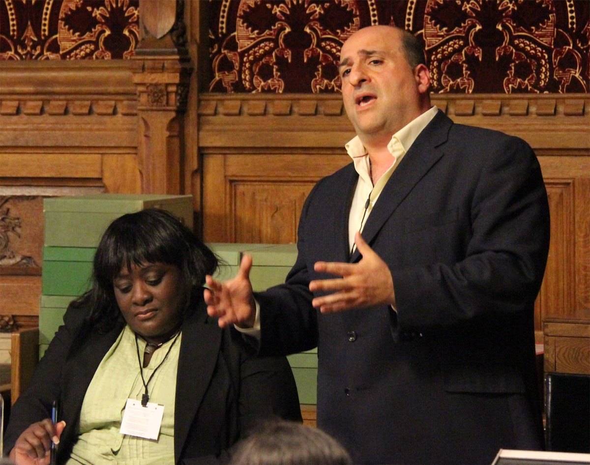 Omid Djalili, actor and comedian, addresses a seminar on human rights in Iran held at the United Kingdom's Houses of Parliament on 15 June. Mr. Djalili praised the fortitude and perseverance of the Iranian Baha'i community. Seated beside him is Khataza Gondwe of Christian Solidarity Worldwide.