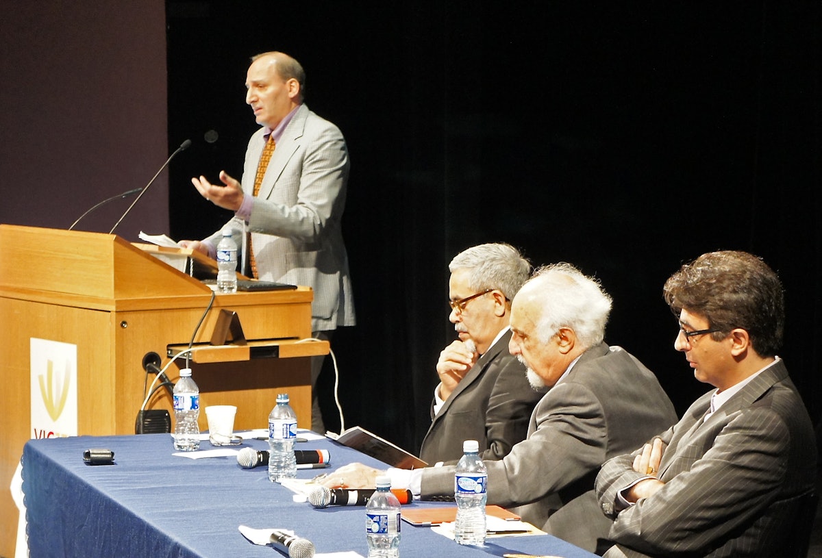 Ramin Jahanbegloo, far left, – a professor of Political Science at the University of Toronto, who spent four months in an Iranian prison – speaks about the importance of including the Baha'i question in any future effort at national reconciliation in Iran. "Forgiveness does not mean forgetting," he said. Seated left to right are Saeed Rahnema, York University; Mansour Farhang, Bennington College; and Arash Naraghi, Moravian College.