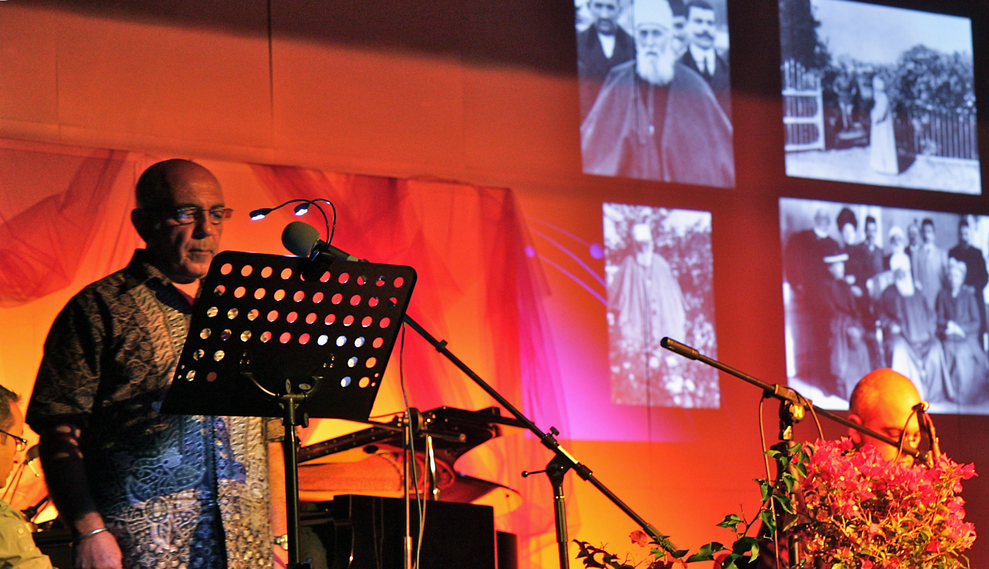 Recollections of 'Abdu'l-Baha's travels to France underpinned the discussions at the annual residential Baha'i summer school in France, held this year in Evian, 27 August-3 September. Here, a prayer is recited in the Persian language alongside projected images of 'Abdu'l-Baha.