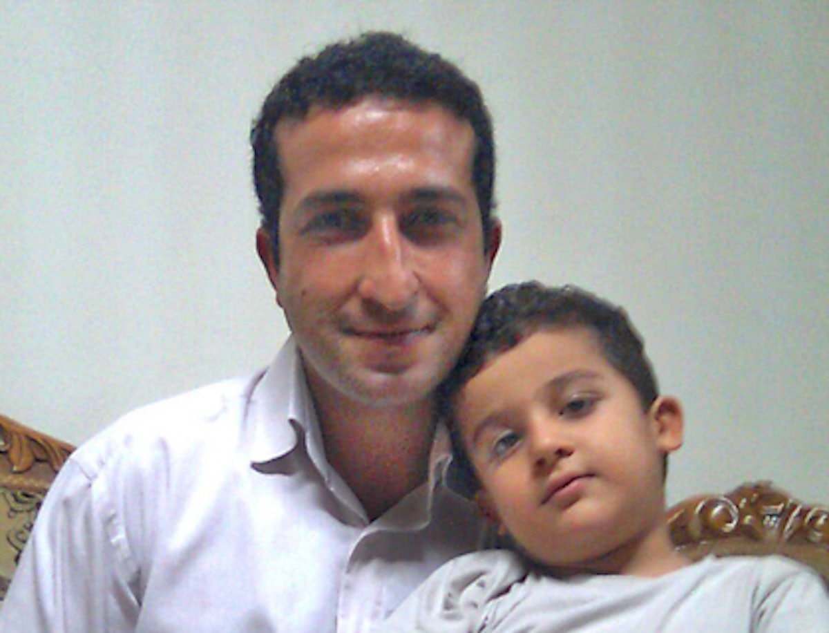 Pastor Youcef Nadarkhani, pictured with his younger son. Photo credit: Christian Solidarity Worldwide.
