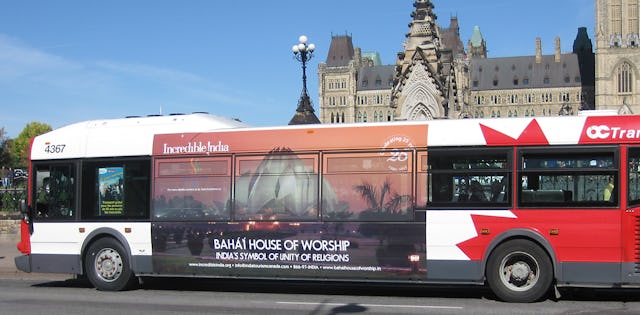 A poster of the Baha'i House of Worship in New Delhi depicted on the side of a bus in Ottawa, Canada, as part of the Indian government's global "Incredible India" campaign.