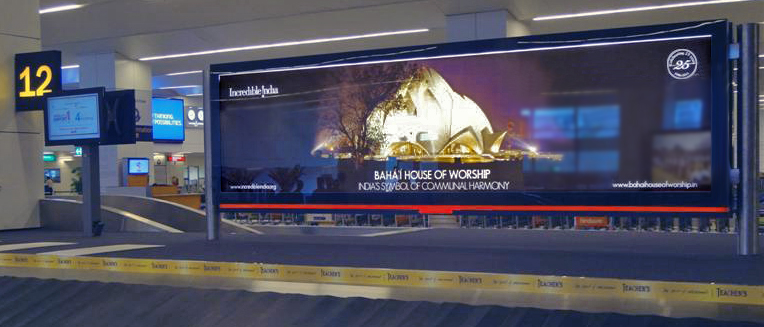 Passengers arriving at New Delhi's international airport now encounter the image of the Baha'i House of Worship, "India's symbol of communal harmony," as they await their baggage.