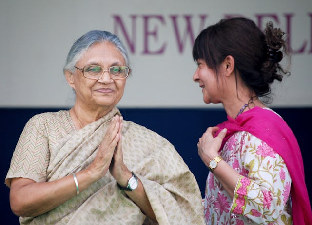 The Chief Minister of Delhi, Mrs. Sheila Dikshit – pictured left – greets the more than 5,000 visitors assembled for the 25th anniversary celebrations of the Baha'i House of Worship, 11-12 November 2011. She is welcomed to the stage by Naznene Rowhani, Secretary of the National Spiritual Assembly of the Baha'is of India.