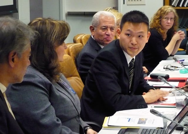 Ming Hwee Chong, pictured center, representative of the Baha'i International Community to the United Nations, addresses a panel discussion held at the UN as part of this year's session of the Commission for Social Development. Pictured far left is Jomo Kwame Sundaram, UN Assistant Secretary General for Economic Development.