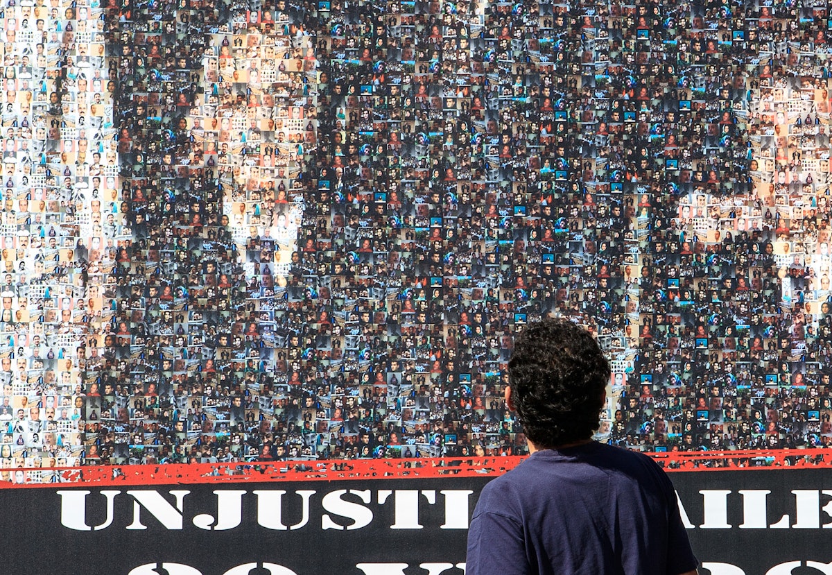 The mobile billboard image of the Baha'i leaders seen around the world was a mosaic of smaller photographs of hundreds of people currently jailed in Iran including journalists, trade unionists, politicians, student and women's activists, and religious leaders.