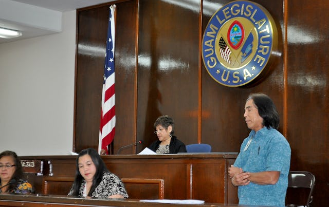 Speaker Judith Won Pat – pictured center – addresses the Guam legislature during a vote about the denial of access to higher education in Iran. The vote, which passed by a majority of 14-0, was held on 27 April 2012.
