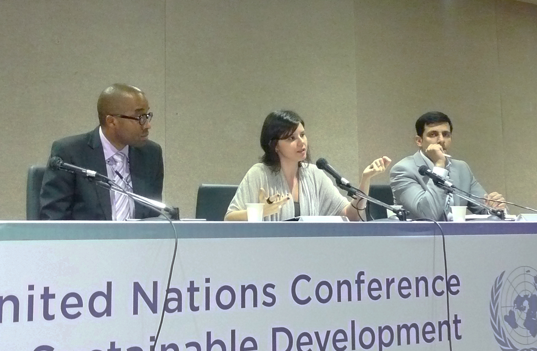 A Baha'i International Community-sponsored panel discussion on the "Elimination of Extremes of Wealth and Poverty in a Green Economy Context" was held at Rio+20, 13 June 2012. Pictured, from left, are Michael Dorsey – assistant professor of environmental studies, Dartmouth College; Daniella Hiche – Baha'i International Community; and Farooq Ullah – head of policy and advocacy at the Stakeholder Forum.