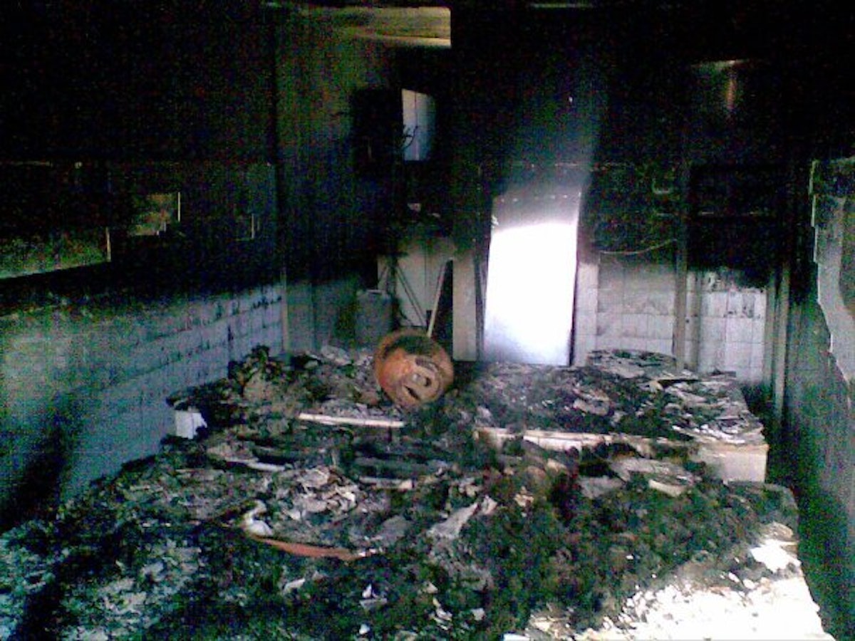 Interior view of a mortuary building used to prepare bodies in the Semnan Baha'i cemetery, after being attacked by arsonists in February 2009.