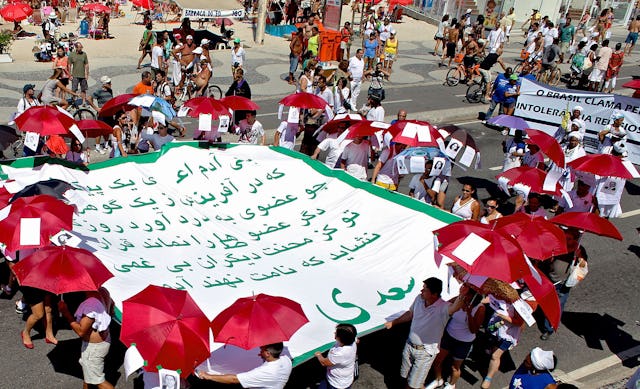 Verses by the Persian poet Sa'di displayed along the seafront of Rio's Copacabana beach as part of the Fifth Walk in Defense of Religious Liberty, held on Sunday 16 September 2012.