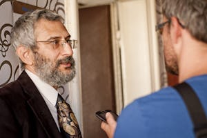 Dr. Grigorij Mesežnikov, president of the Institute for Public Affairs – pictured left – is interviewed at a press conference, held in Bratislava, 17 September 2012, which launched an open letter from 84 Slovak academics calling for an end to the persecution of Baha'i educators and students in Iran.