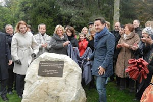 Luxembourg City's mayor Xavier Bettel – pictured right of the stone – unveiled a monument on 30 October 2012, marking the 50th anniversary of the first election of the National Spiritual Assembly of the Baha'is of Luxembourg.